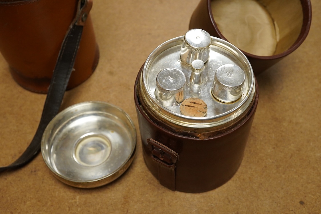 Two silver plate mounted flasks in cases to include a three sectioned example, largest 19cm high